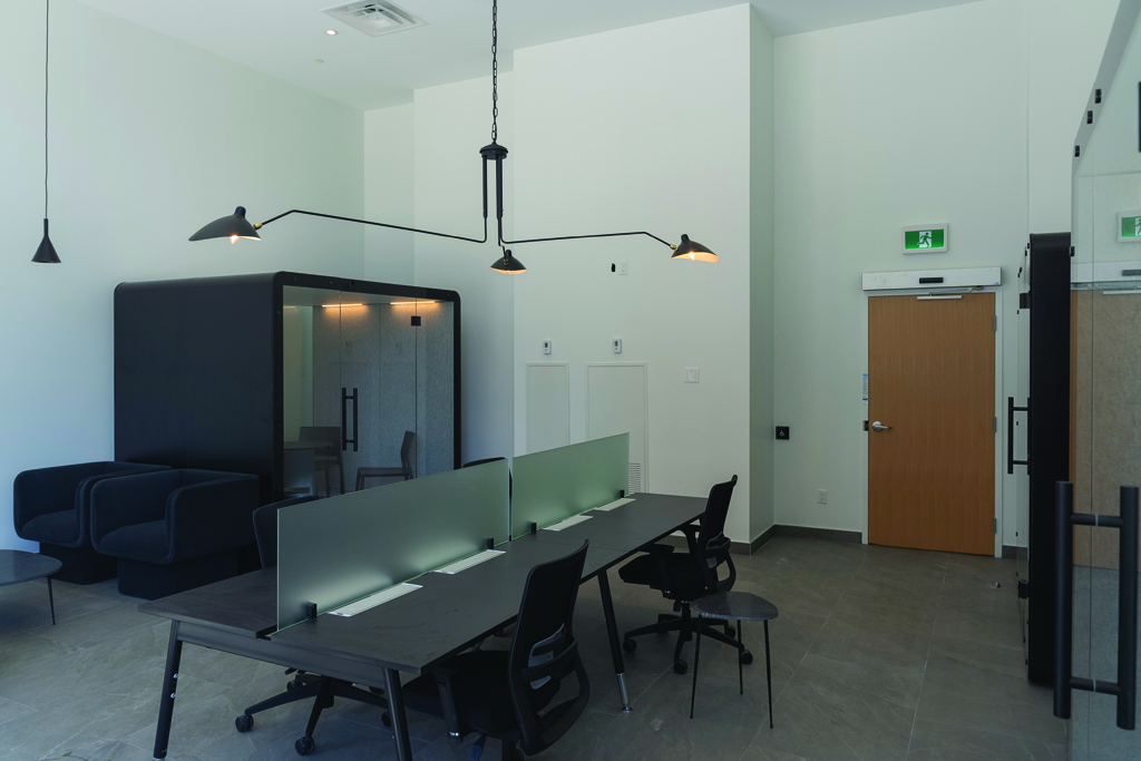 business centre of 80 Bond featuring luxury and contemporary furniture, work cubicles and soundproof pods